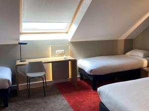 Ibis Wavre Brussels East में एक कमरे में एक या कई बेड