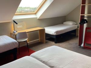 Ibis Wavre Brussels East में एक कमरे में एक या कई बेड