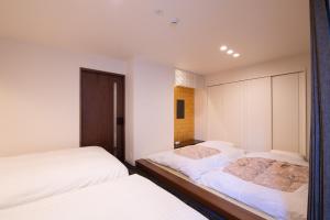 Una cama o camas en una habitación de Hotel Celeste Shizuoka