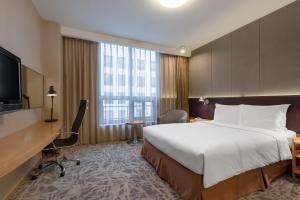 Voodi või voodid majutusasutuse LeafIN Hotel Beijing Minzuyuan toas