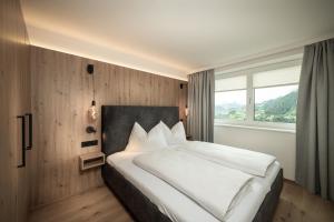 Una cama o camas en una habitación de Appartement Alpenrot