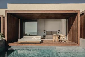 a master bedroom with a bed and a pool at Meraviglia Slow Living in Preveza