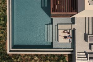 an overhead view of a pool with a person on it at Meraviglia Slow Living in Preveza