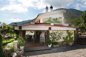 a building with a mural on the side of it at Villa Ida Bed & Breakfast in Terracina