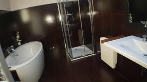 a bathroom with a shower and a toilet and a sink at Villa castelló salou in Salou