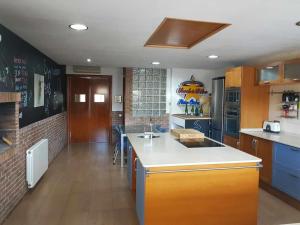 a kitchen with a sink and a counter top at Villa castelló salou in Salou