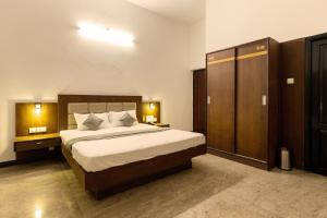 Krevet ili kreveti u jedinici u okviru objekta Hotel Paramount Suites & Service Apartments