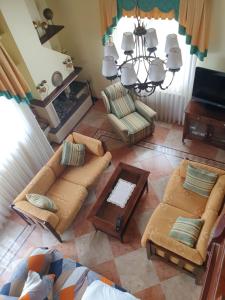 an overhead view of a living room with couches and a table at Casa La Quintana in Castro-Urdiales