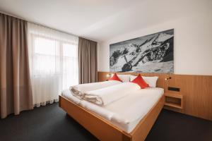 Ліжко або ліжка в номері Apart Garni St Martin - Silvretta Card Premium Betrieb