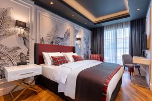 เตียงในห้องที่ Motif Hotel Çeşme