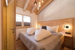 Voodi või voodid majutusasutuse Quality Hosts Arlberg - ALPtyrol Appartements toas