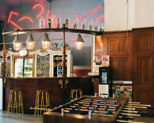 The lounge or bar area at Three Little Pigs Hostel - Your Berlin Castle