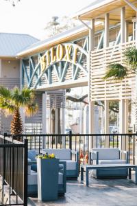 a building with blue chairs and a sign on it at Hotel Legends in Biloxi