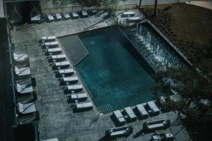 an overhead view of a swimming pool with lounge chairs at Hotel Legends in Biloxi