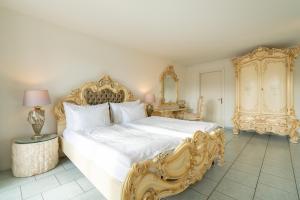 Cama ou camas em um quarto em Altstadt Hotel Magic Luzern