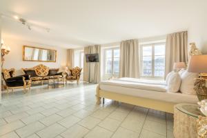 Cama ou camas em um quarto em Altstadt Hotel Magic Luzern