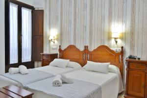 Hotel Marisa में एक कमरे में एक या कई बेड