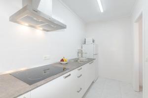 Kuchyň nebo kuchyňský kout v ubytování Apartament Cel de Mar