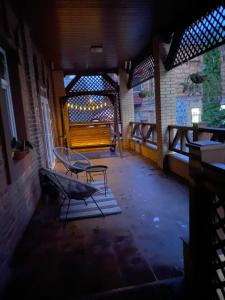 an empty room with a bench and a table at Апартаменты Well - Being in Umanʼ