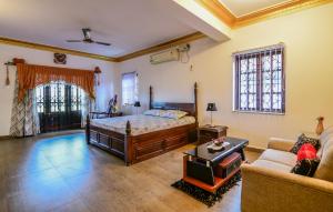 En eller flere senger på et rom på Stunning luxury Villa in Goa India