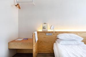 Una cama o camas en una habitación de Tech Spa Coliving&Coworking Spaces