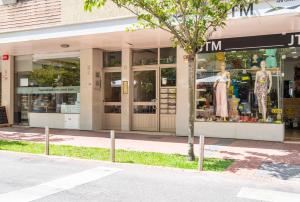 a store on the side of a street at Santos Mattos Guesthouse & Apartments by Lisbon with Sintra in Amadora