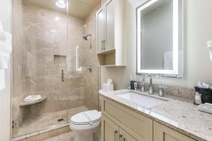 a bathroom with a shower and a toilet and a sink at The Calliope in New Orleans