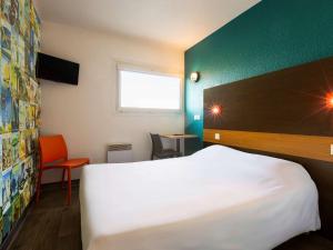 A bed or beds in a room at hotelF1 Longwy