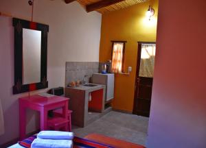 A kitchen or kitchenette at Hostal Paseo de los Colorados