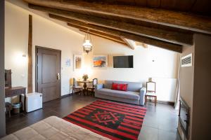 a living room with a couch and a table at Ellinon Thea Arachova in Arachova