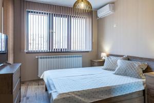 Gulta vai gultas numurā naktsmītnē Apartment Trayana