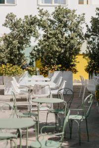 a group of tables and chairs in a courtyard at Marin Hotel in Pula