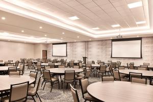 a conference room with tables and chairs and screens at Hyatt Place Phoenix/Downtown in Phoenix