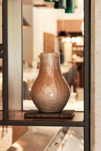 a vase sitting on top of a shelf at Hyatt Place Phoenix/Downtown in Phoenix