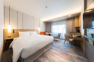 Giường trong phòng chung tại Hotel Metropolitan Edmont Tokyo