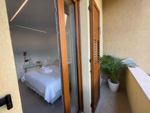 Giường trong phòng chung tại B&B Am Gardasee blick