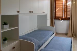 Una cama o camas en una habitación de Il Borgo Appartamenti