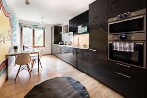 A kitchen or kitchenette at Apartments Kremer Cracow