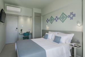 Cama ou camas em um quarto em Arkadi Hotel