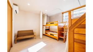 Llit o llits en una habitació de THE GATE HOSTEL SHONAN FUJISAWA