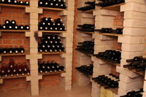 a wall of wine bottles in a wine cellar at Penzion Kasper Cyklopenzion in Jindrichuv Hradec