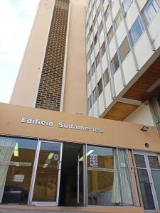 a building with a sign for the entrance to a building at Lilium Apartment & Experiences in Arequipa