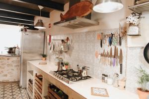 A kitchen or kitchenette at Casa da Madalena Backpackers Hostel