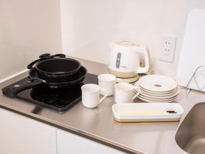 Una cocina o kitchenette en Family Inn Kei 慶