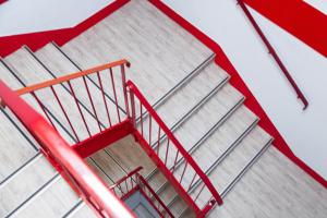 a set of stairs with a red railing at Class'eco Charleroi in Charleroi