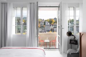 Ruby Mimi Hotel Zurich में एक कमरे में एक या कई बेड