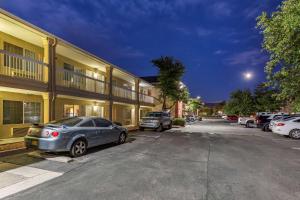 a row of cars parked in front of a building at Suburban Studios in Albuquerque