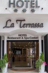 Et logo, certifikat, skilt eller en pris der bliver vist frem på Hotel Spa La Terrassa