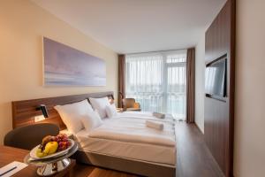 Кровать или кровати в номере Hunguest Hotel Panoráma