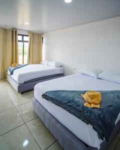 Tempat tidur dalam kamar di Hostel Cattleya - Monteverde, Costa Rica